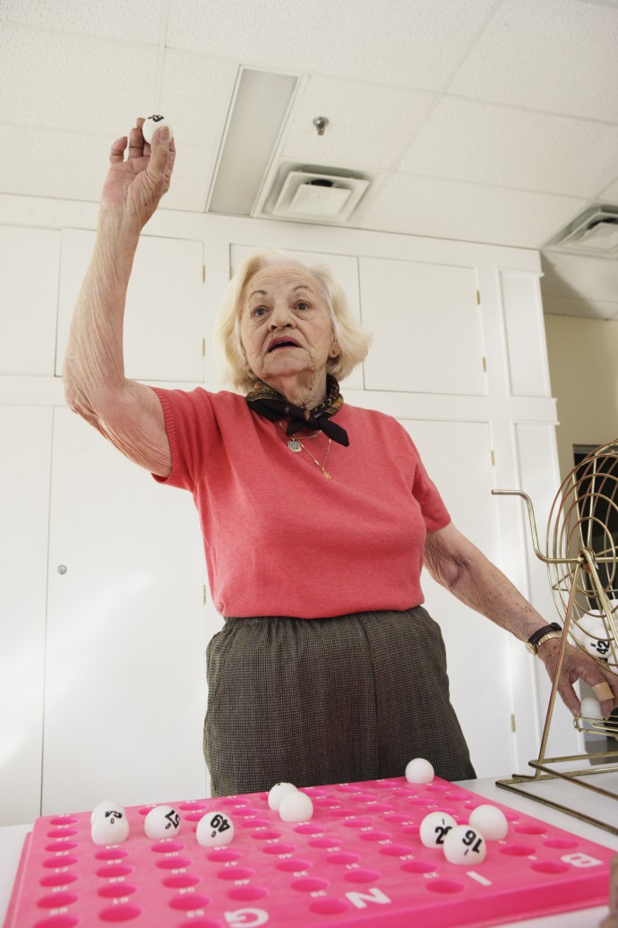 Elderly woman playing bingo